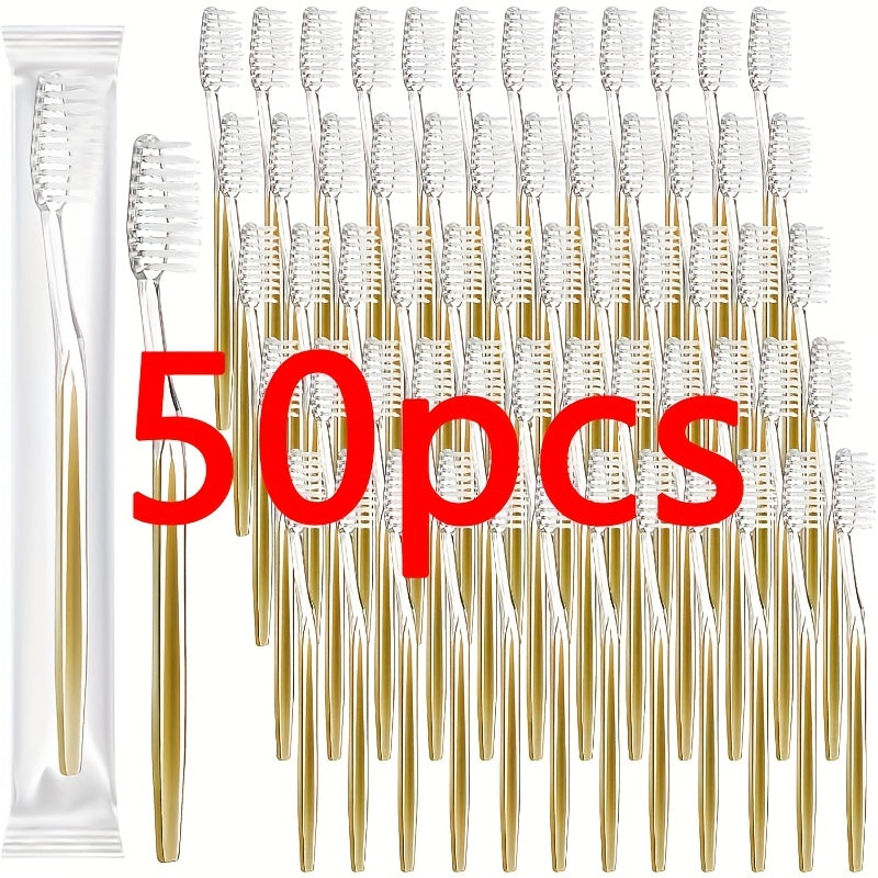 Un paquet de 50 brosses à dents jetables avec des poils mi-doux, des brosses à dents manuelles en nylon, emballées individuellement pour les voyages et les hôtels, adaptées aux soins bucco-dentaires des adultes.
